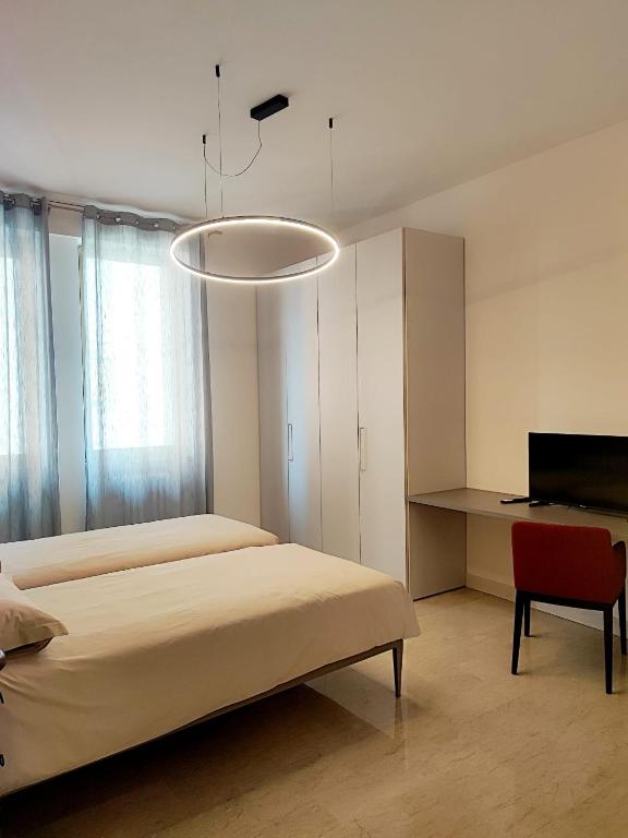 Postel nebo postele na pokoji v ubytování Foresteria Juvarra