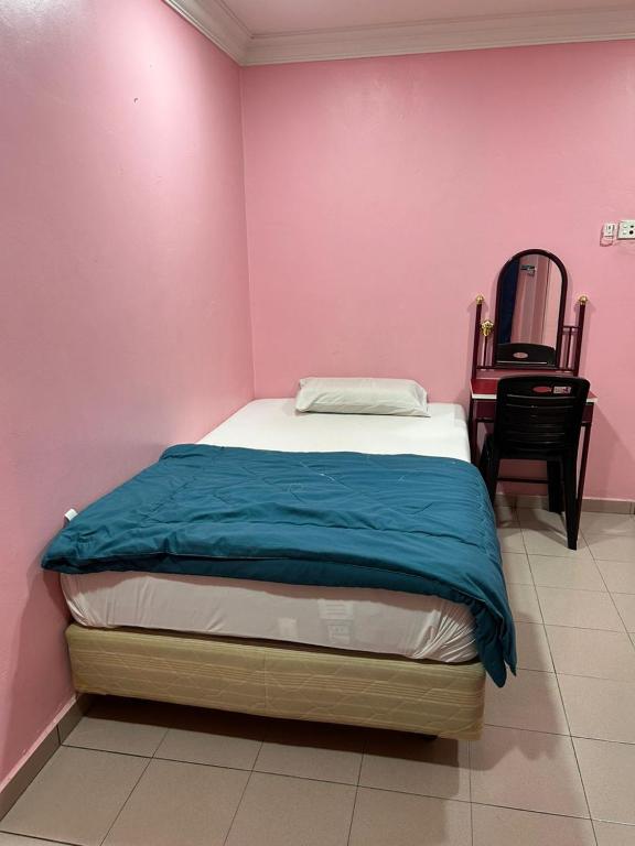 Postel nebo postele na pokoji v ubytování Hotel Cahaya