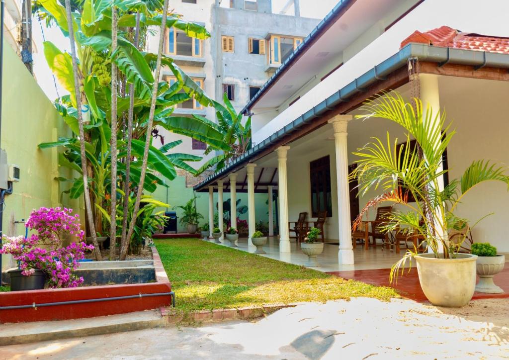 a courtyard of a house with plants at The Islands Breeze Villa in Dehiwala