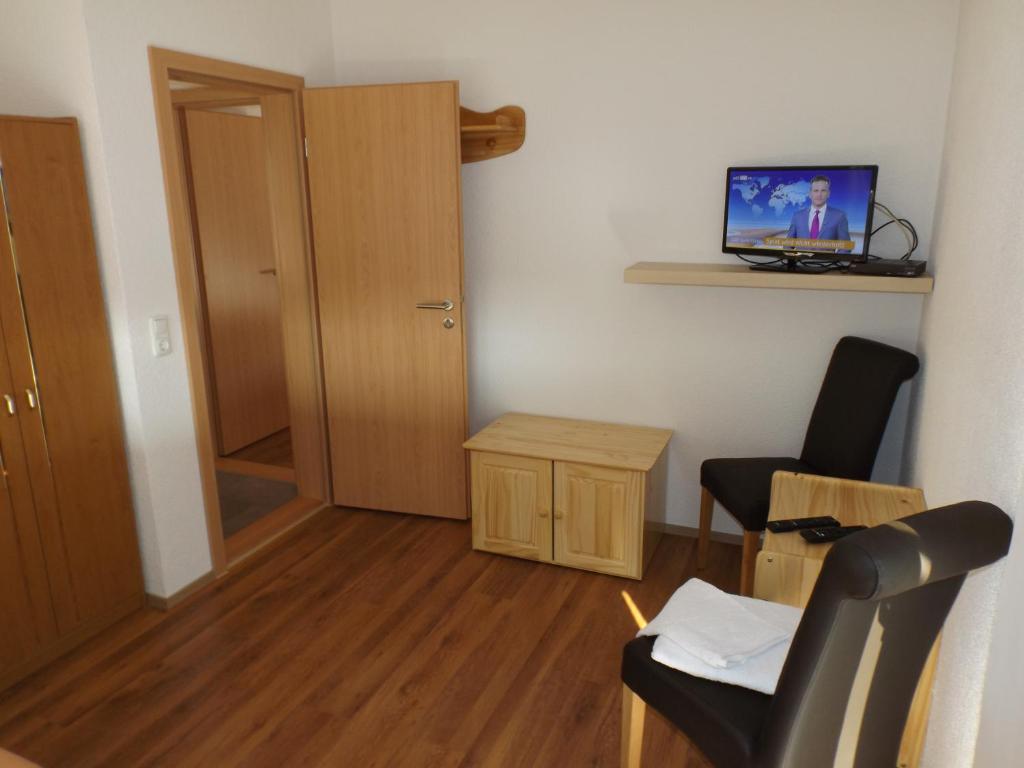 TV a/nebo společenská místnost v ubytování Pension Rego