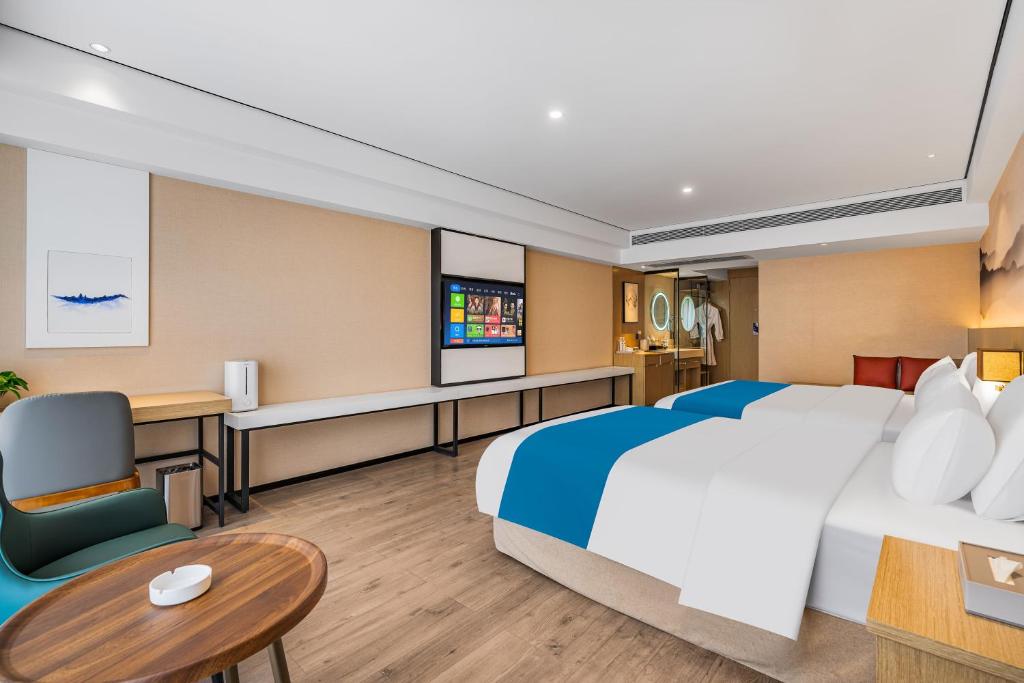 Ramada Encore by Wyndham Kunming Guanduにあるベッド