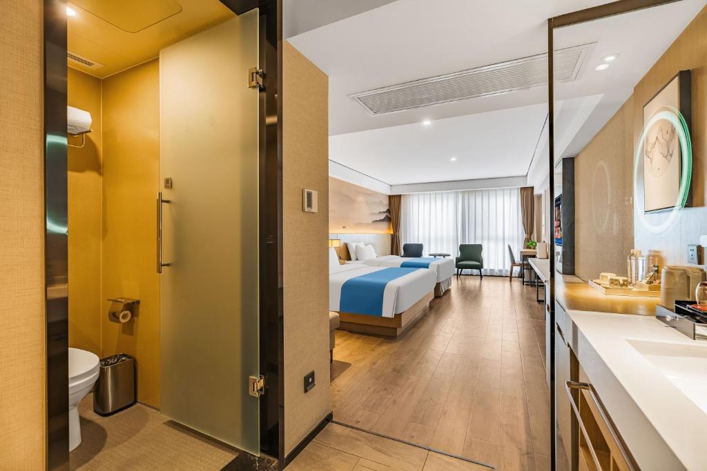 Ramada Encore by Wyndham Kunming Guanduにあるベッド