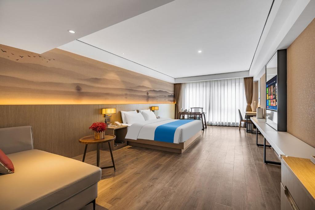 Ramada Encore by Wyndham Kunming Guanduにあるベッド