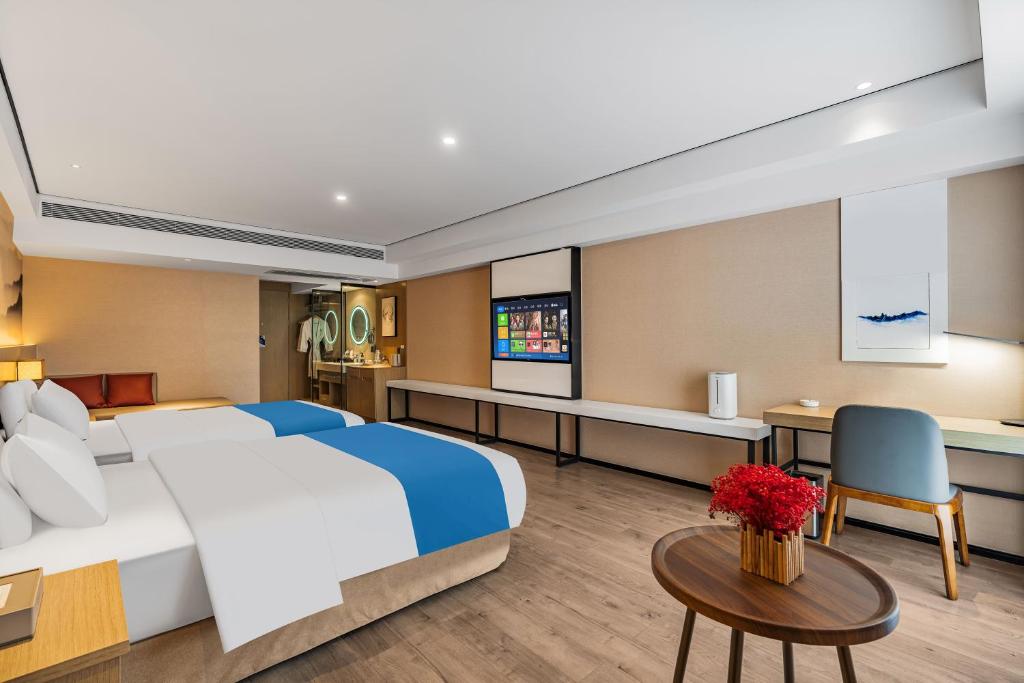 Ramada Encore by Wyndham Kunming Guanduにあるベッド