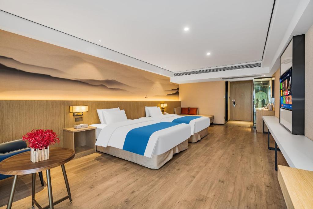 Ramada Encore by Wyndham Kunming Guanduにあるベッド