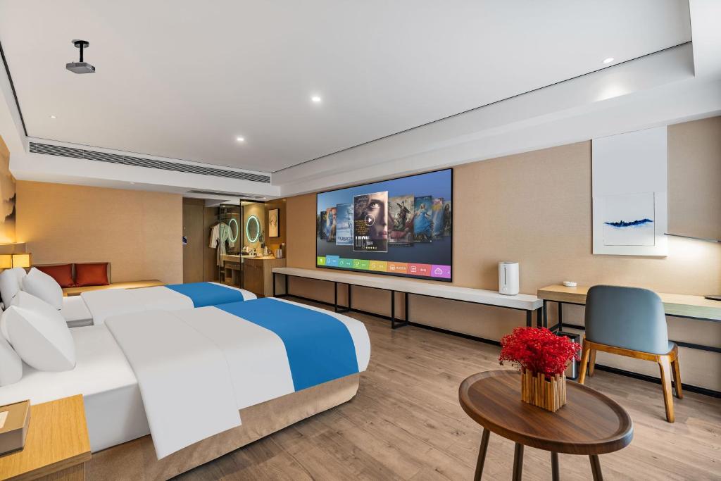 Ramada Encore by Wyndham Kunming Guanduにあるテレビまたはエンターテインメントセンター