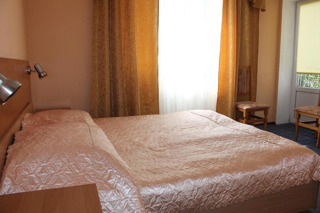 Postel nebo postele na pokoji v ubytování Zakarpattya