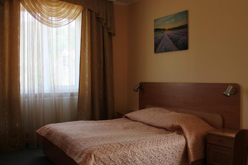 Postel nebo postele na pokoji v ubytování Zakarpattya