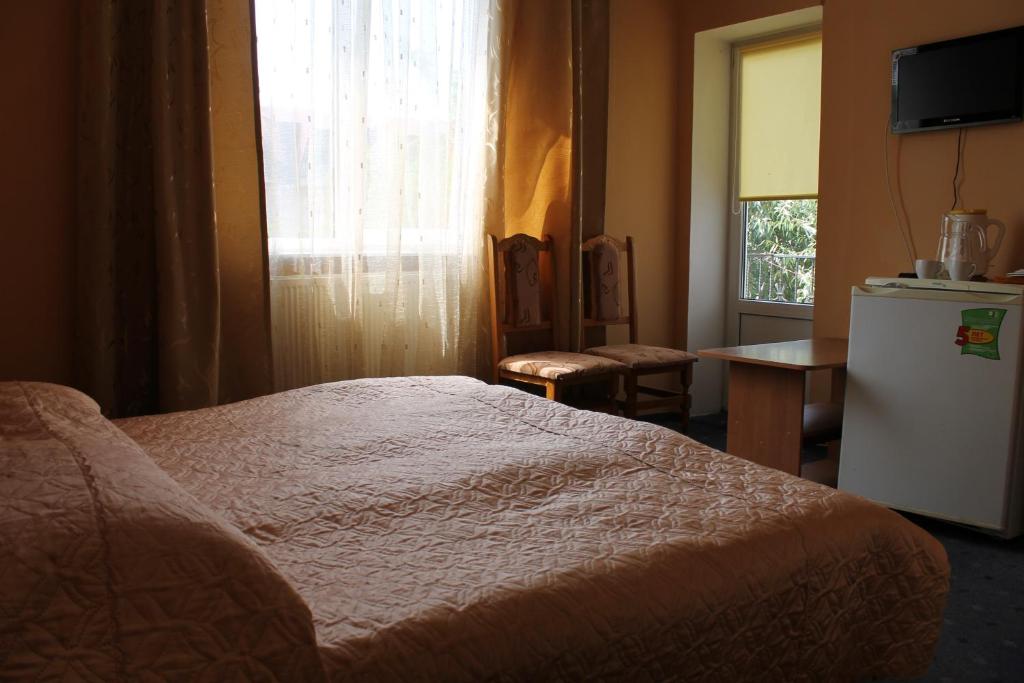 Postel nebo postele na pokoji v ubytování Zakarpattya