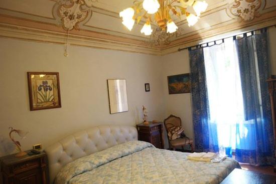 Tempat tidur dalam kamar di Antica Dimora Fuori Le Mura B&B