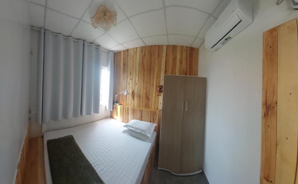 Postel nebo postele na pokoji v ubytování NT House