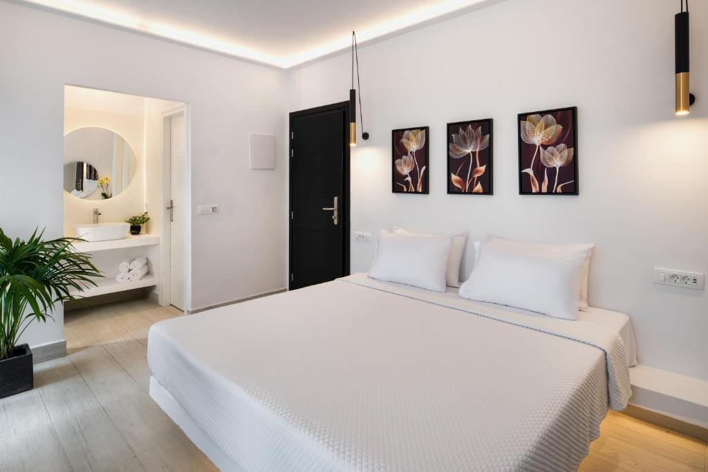 Postel nebo postele na pokoji v ubytování Palm Island Suites