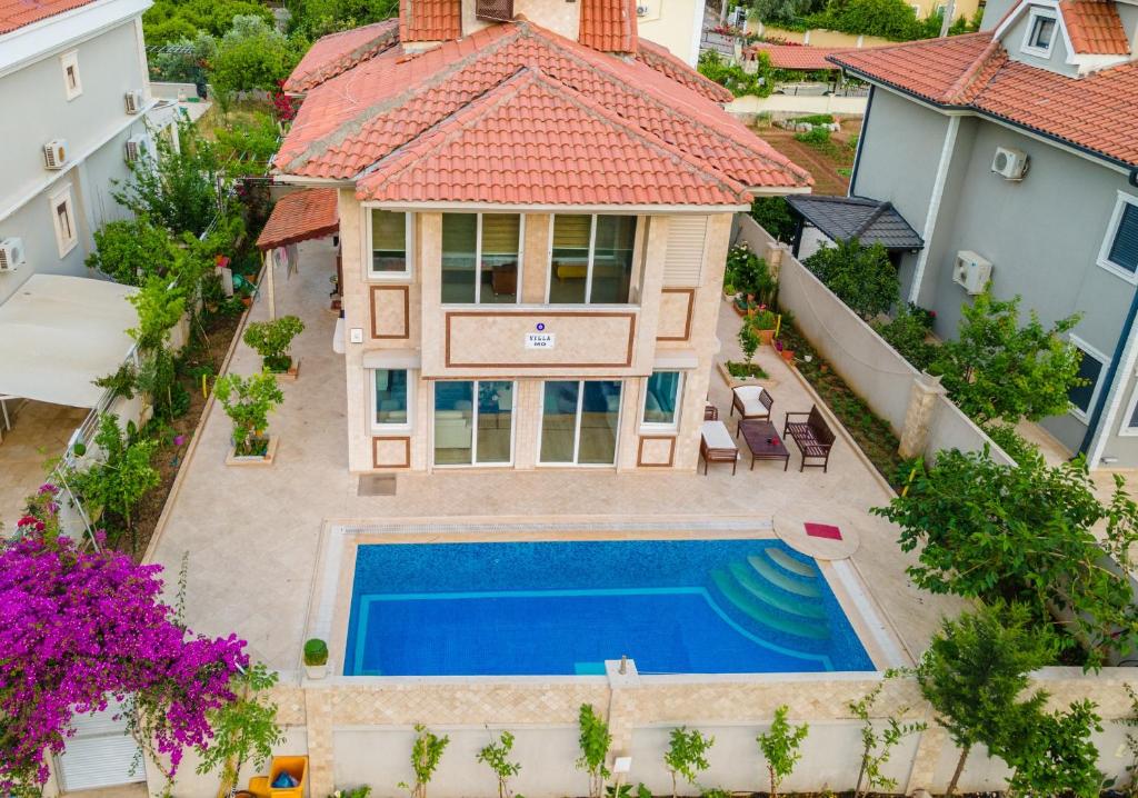 an aerial view of a house with a swimming pool at Villa MO DAİLY WEEKLY rentals İçmeler in Marmaris
