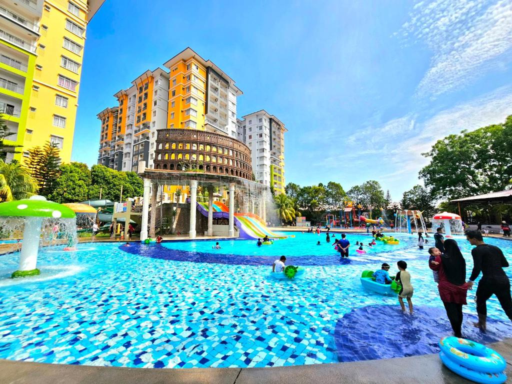 a group of people playing in a water park at BY LG Water Themepark Facilities & Suites By GGM in Melaka