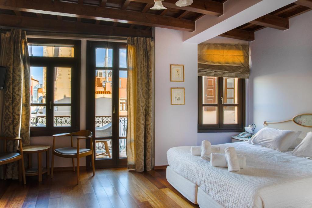 Postel nebo postele na pokoji v ubytování Palazzo Duca