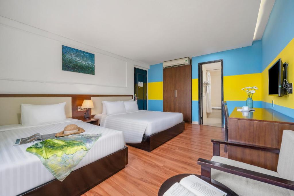Postel nebo postele na pokoji v ubytování Bantique Hotel