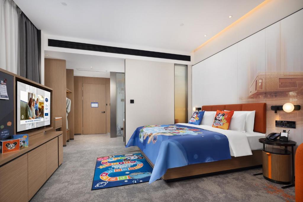 Postel nebo postele na pokoji v ubytování Hampton by Hilton Dongguan Liaobu Songshan Lake Avenue