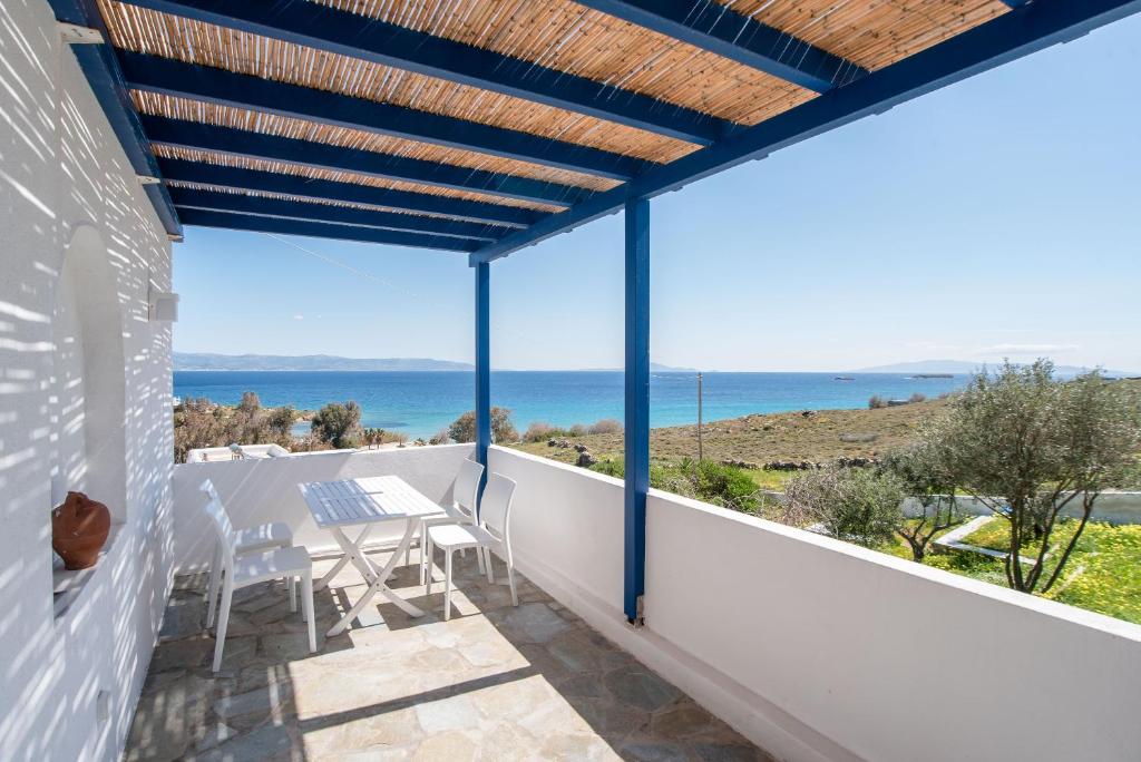 a balcony with a view of the ocean at Punda Beach Seaside Retreat in Logaras