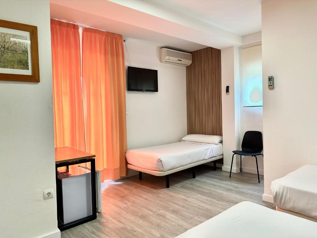 Postel nebo postele na pokoji v ubytování Hotel Victoria Centro