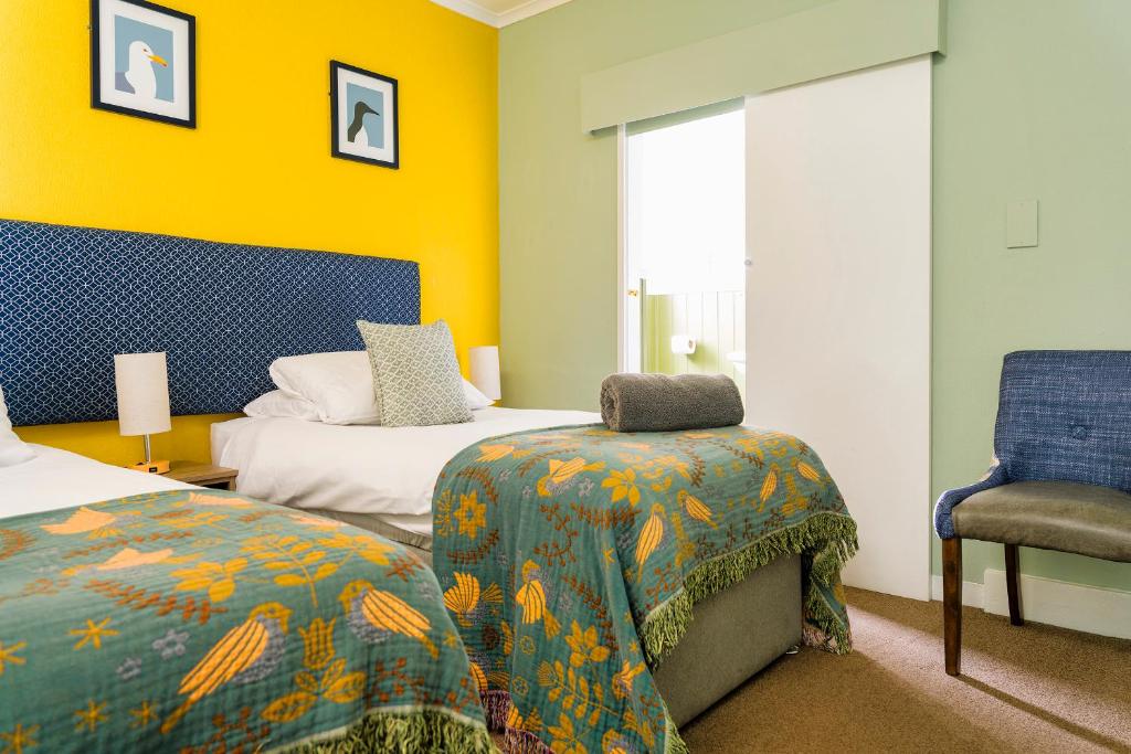 Кровать или кровати в номере Sandcliff Guest House