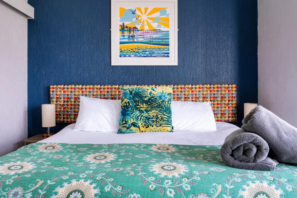 Кровать или кровати в номере Sandcliff Guest House