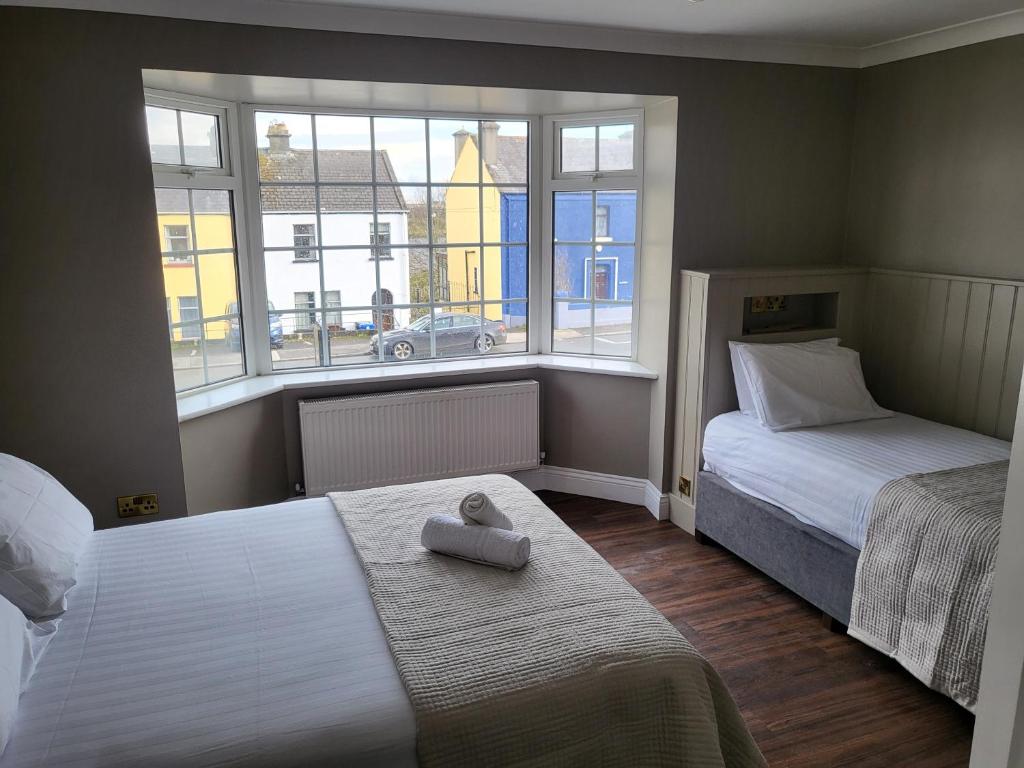 Postel nebo postele na pokoji v ubytování Urban Nest Townhouse