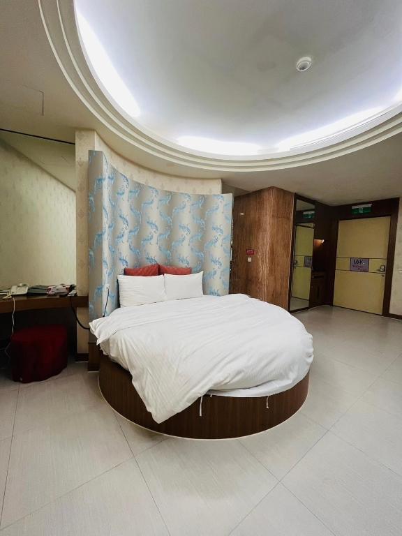 Postel nebo postele na pokoji v ubytování Walker Hotel - Chengde