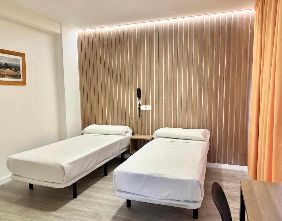 Postel nebo postele na pokoji v ubytování Hotel Victoria Centro