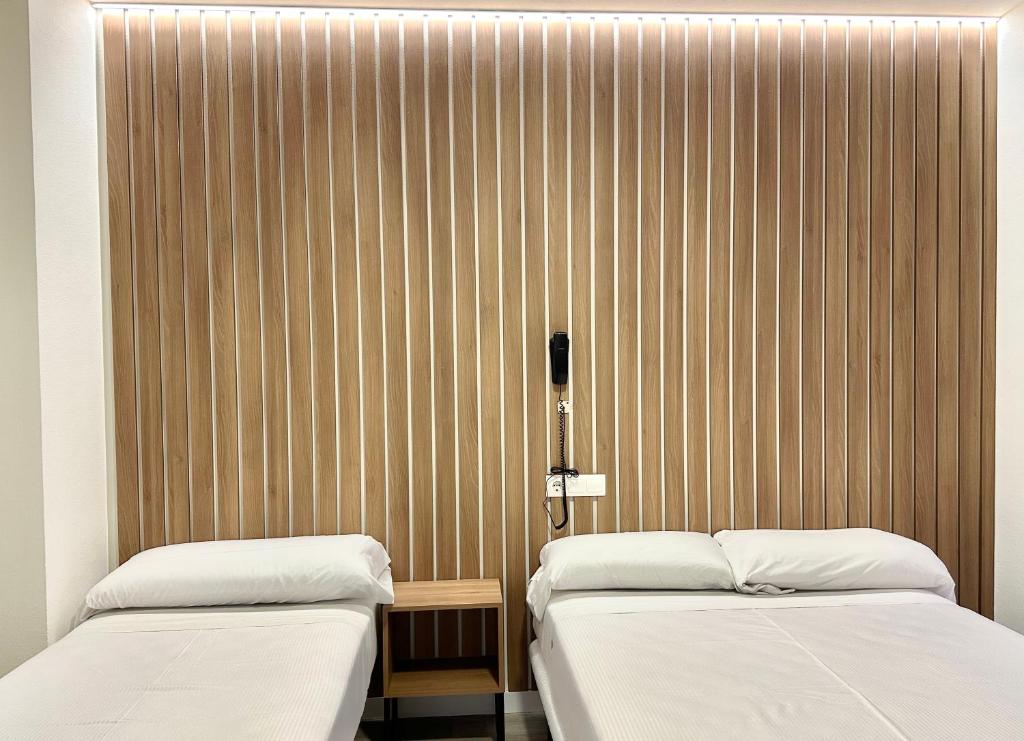 Postel nebo postele na pokoji v ubytování Hotel Victoria Centro
