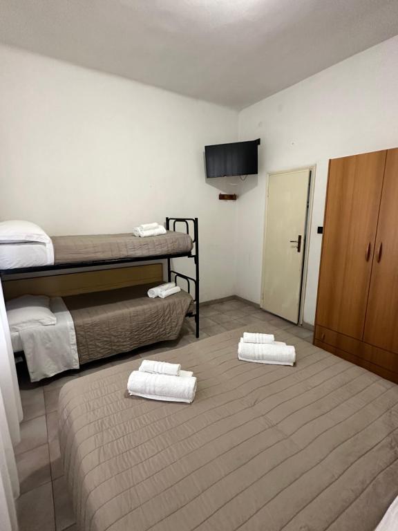 Postel nebo postele na pokoji v ubytování Hotel Enna Rimini