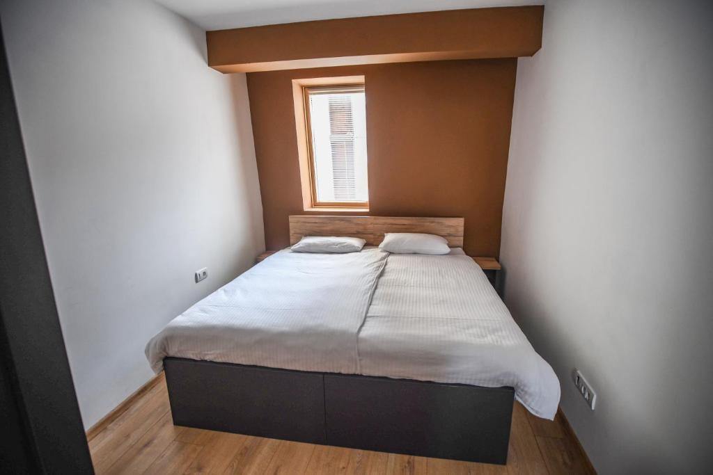 Postel nebo postele na pokoji v ubytování Apartments and rooms Max-Well