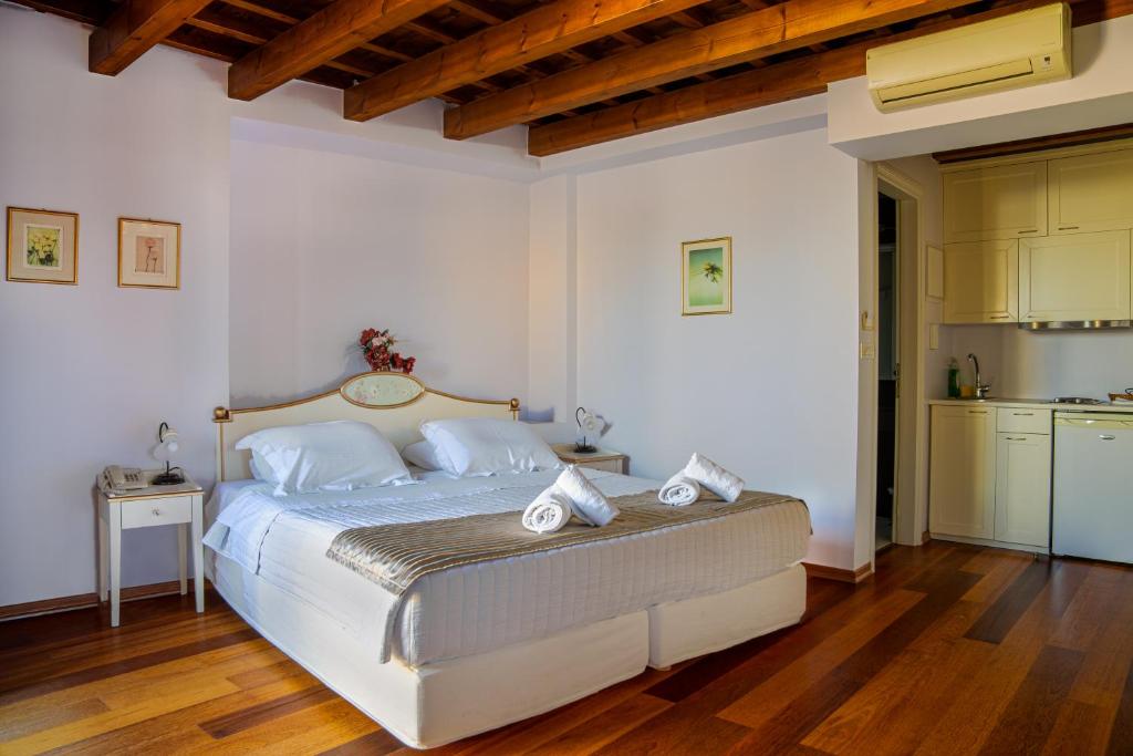Postel nebo postele na pokoji v ubytování Palazzo Duca