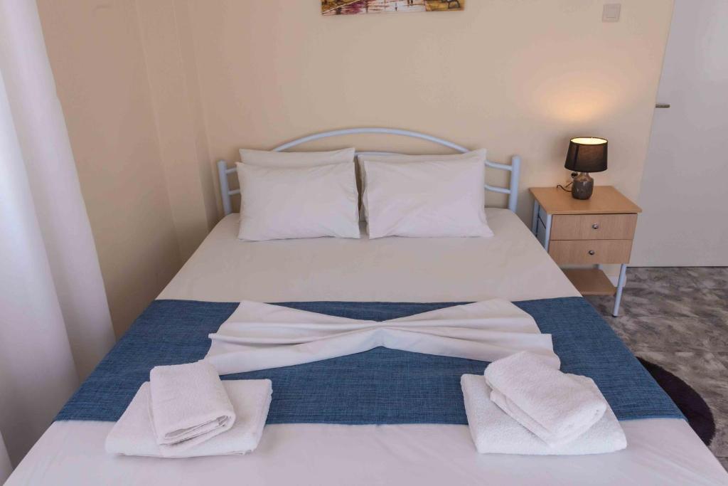 Posteľ alebo postele v izbe v ubytovaní Greekhome Seaside Apartment