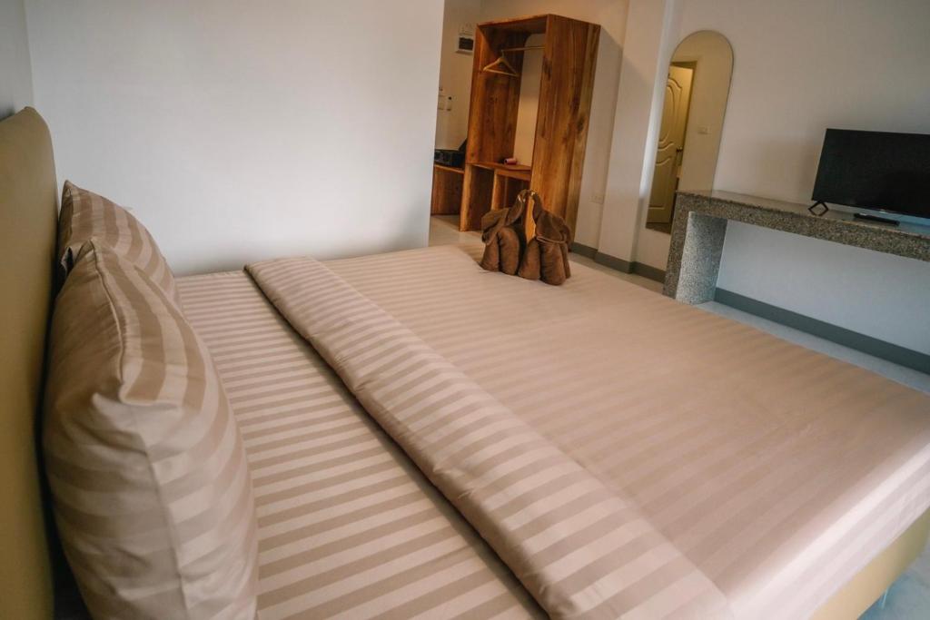 Postel nebo postele na pokoji v ubytování Chor Grande Resort
