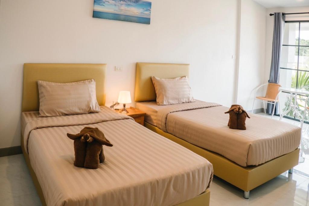 Postel nebo postele na pokoji v ubytování Chor Grande Resort