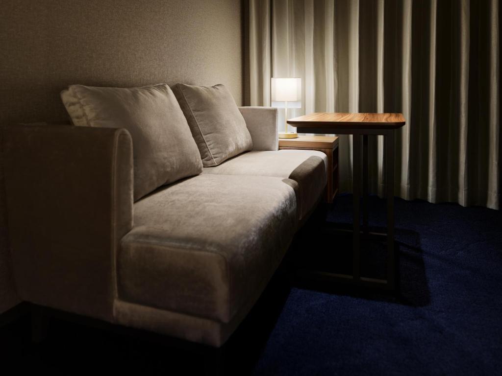 Postel nebo postele na pokoji v ubytování Mitsui Garden Hotel Gotanda - Tokyo