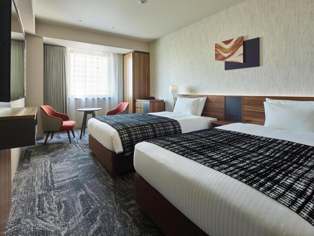 Postel nebo postele na pokoji v ubytování Mitsui Garden Hotel Gotanda - Tokyo