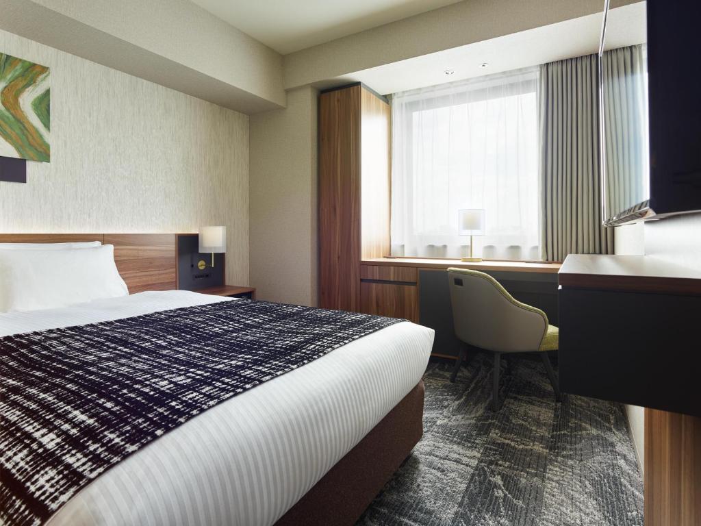 Postel nebo postele na pokoji v ubytování Mitsui Garden Hotel Gotanda - Tokyo