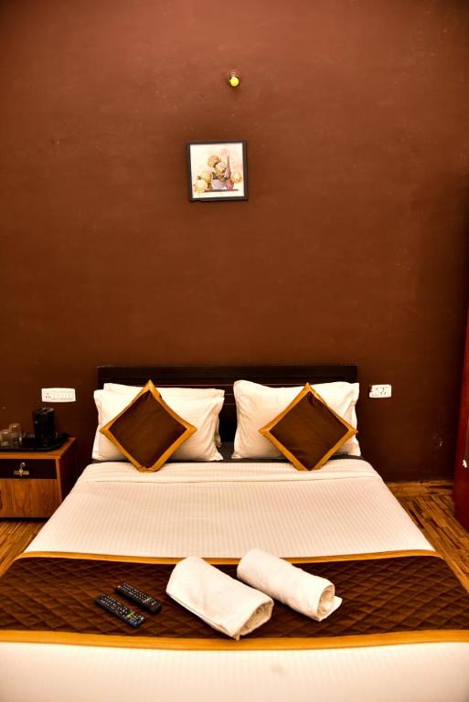 Postel nebo postele na pokoji v ubytování Phoenix View Stay Ooty