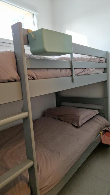 a couple of bunk beds in a room at Archipel Capri in Valras-Plage