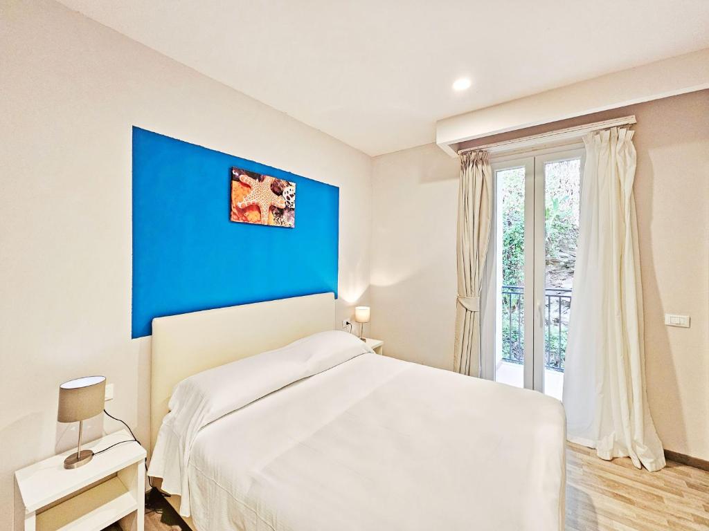 Łóżko lub łóżka w pokoju w obiekcie Hotel l'Approdo
