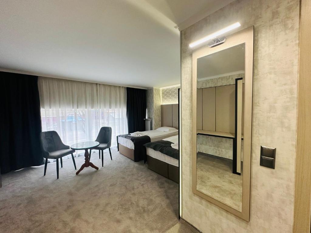 Postel nebo postele na pokoji v ubytování Hotel Cosmos