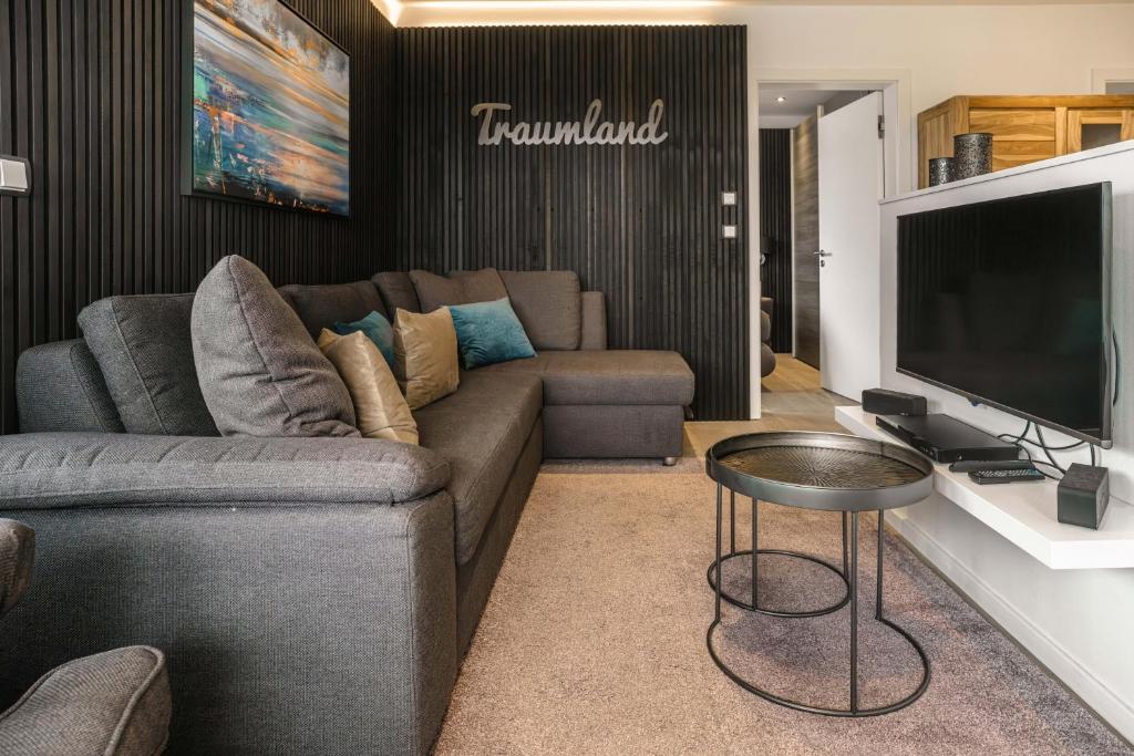 TV a/nebo společenská místnost v ubytování Baltic House Möwe