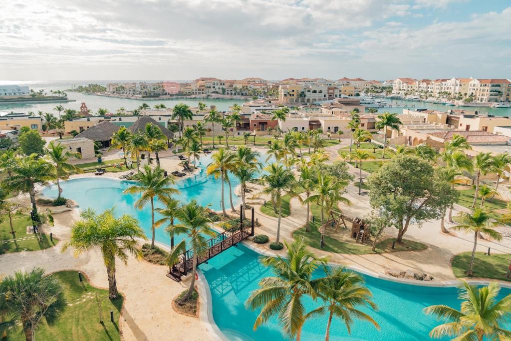 an aerial view of a resort with palm trees at Sports Illustrated Resorts Marina and Villas Cap Cana - All-Inclusive in Punta Cana