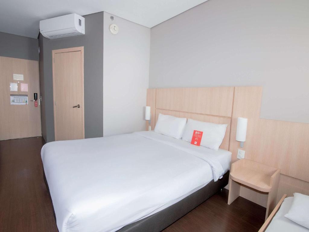 Cama ou camas em um quarto em ibis Medellin