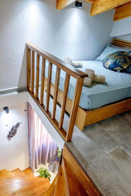 a bedroom with a bunk bed and a staircase at Old Town Studio's Rethymno City in Rethymno