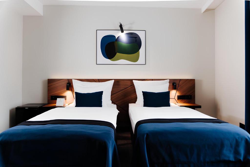 Posteľ alebo postele v izbe v ubytovaní Ascot Premium Hotel