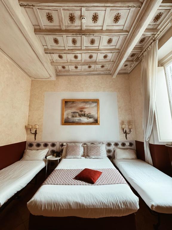 A bed or beds in a room at Residenza Sciarra B&B