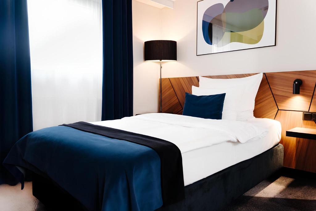 Posteľ alebo postele v izbe v ubytovaní Ascot Premium Hotel