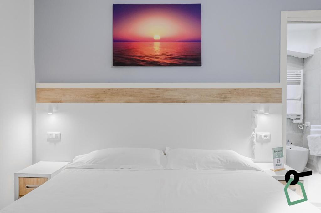 Postel nebo postele na pokoji v ubytování Hotiday Room Collection - Rapallo